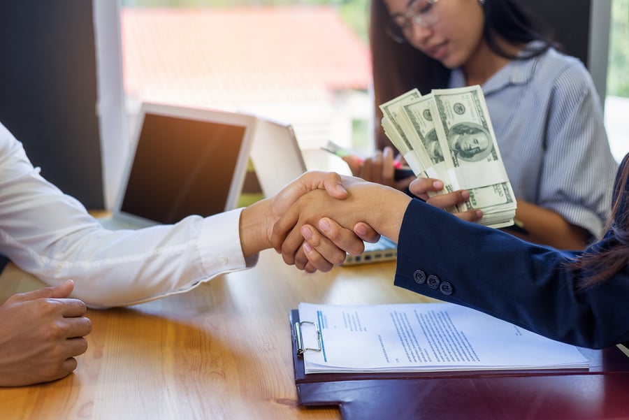 Business Woman Signing a Loan for Investment